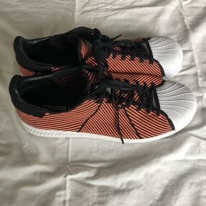 Orange Adidas Superstars